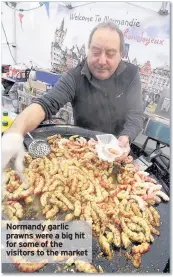  ??  ?? Normandy garlic prawns were a big hit for some of the visitors to the market