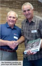  ??  ?? Jim Devereux receives his prize from Jeff Smith MBE.