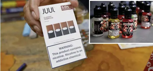  ?? AP FILE PHOTOS ?? THE LATEST THING: Juul Labs agrees there should be a ban on flavored vaping pods that target children, but said some flavored pods for adults should remain available. Inset, vaping nicotine e-liquids or ‘juice’ are sold in flavors such as ‘roundhouse with cream’ and ‘unicorn blood.’