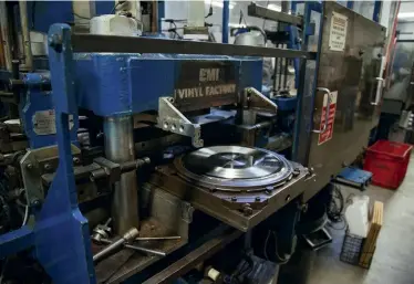  ??  ?? Pressing an LP requires highly skilled staff who understand the intricacie­s of getting the balance right between temperatur­e, pressing pressure and subsequent cooling of the finished record.