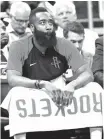  ?? John Raoux/Associated Press ?? ■ Houston Rockets’ James Harden watches his teammates on the court against the Orlando Magic on Sunday in Orlando, Fla.