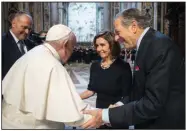  ?? (AP/Vatican Media) ?? Pope Francis greets House Speaker Nancy Pelosi and her husband, Paul Pelosi, before celebratin­g a Mass on Wednesday in St. Peter’s Basilica at the Vatican.