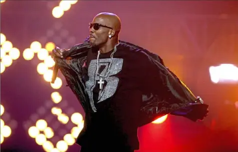  ?? David Goldman/ Associated Press ?? DMX performs during the BET Hip Hop Awards in Atlanta in 2011. The gruff- voiced rapper died Friday at a hospital in White Plains one week after suffering a heart attack.