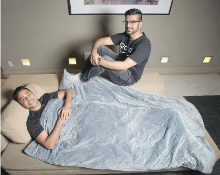  ?? PETER J. THOMPSON ?? Gravid co-founders Omar Shahban, right, and Fahd Javed are learning how to deal with escalating demand for their weighted blanket, which has been selling out on their website. They are working with partners to reduce their lead times and eventually...