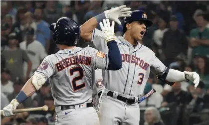  ?? Photograph: Ted S Warren/AP ?? The Astros' Jeremy Peña (3) celebrates a home run against the Mariners with Alex Bregman (2) during the 18th inning of Saturday’s game.