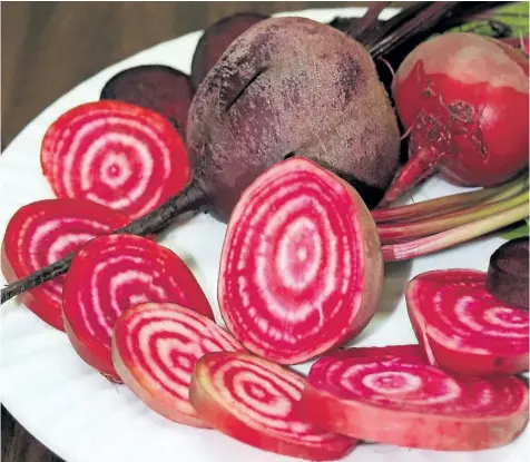  ?? PHOTOS COURTESY NATIONAL GARDEN BUREAU ?? Merlin beets have a uniform round shape, very smooth skin and deep red colouring. The leaves are deep green and glossy throughout the growing season.