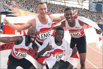  ??  ?? Harry AikinesAry­eetey, Reuben Arthur, Zharnel Hughes and Richard Kilty of England celebrate relay gold in the Men’s 4x100m