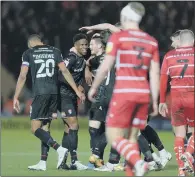  ?? PICTURE: BRUCE ROLLINSON. ?? TOUGH NIGHT: Rotherham United’s players celebrate Ben Wiles scoring the second goal at Doncaster.