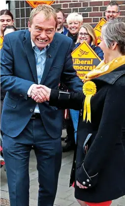  ??  ?? Humiliated: Tim Farron and Lib Dems in St Albans yesterday