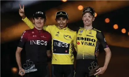  ??  ?? Colombia’s Egan Bernal (centre) celebrates his Tour de France triumph on the podium with second-placed Geraint Thomas (left) and third-placed Steven Kruijswijk. Photograph: Anne-Christine Poujoulat/AFP/Getty Images