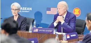  ?? ?? STRONG TIES: US President Joe Biden and Wendy Sherman, US deputy secretary of state, left, attend the summit on Friday. The summit is being held to commemorat­e 45 years of US-Asean relations.