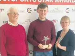  ?? ?? Sean O’Sullivan receiving his Sport Star of the Month award, pictured with his proud parents Mossie and Helen.