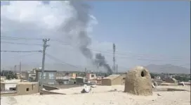  ?? AFP ?? Smoke rising into the air after Taliban militants launched an attack on Ghazni on Friday.