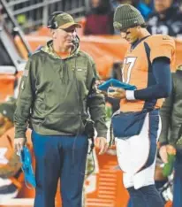  ?? John Leyba, The Denver Post ?? Bill Musgrave, left, was in charge of quarterbac­k Brock Osweiler and the other QBs. Now he’s in charge of the entire offense as its coordinato­r.