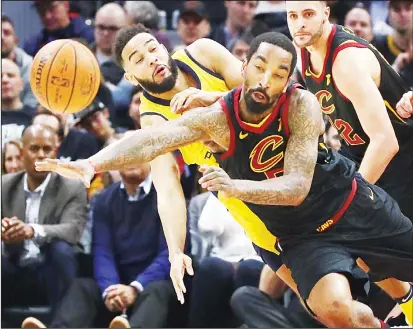  ?? (AFP) ?? J.R. Smith #5 of the Cleveland Cavaliers and Cory Joseph #6 of the Indiana Pacers drive for a ball during the first half in Game One of the Eastern Conference Quarter-finals during the 2018 NBA Playoffs at Quicken Loans Arena on April 15, in Cleveland,...