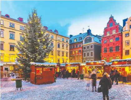  ?? GETTY IMAGES ?? Christmas markets and snowy streets make December an especially magical time of the year to visit the Swedish capital of Stockholm, and a great time to sample glögg, a delicious mulled red wine.