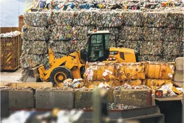  ?? Josie Norris / The Chronicle ?? A wall of baled plastic looming over Recology’s Recycle Central represents one day’s worth of San Francisco’s plastic and water bottles. Low-grade plastic shipped to other countries has polluted them.