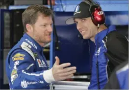  ?? CHUCK BURTON, THE ASSOCIATED PRESS ?? Dale Earnhardt Jr. talks with crew chief Greg Ives during practice for a NASCAR Cup series auto race at the Charlotte Motor Speedway in May.