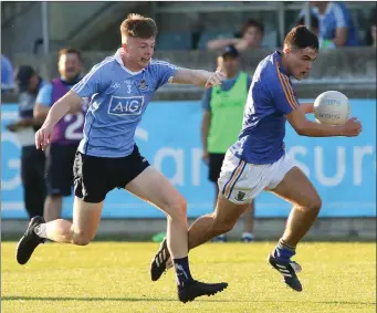  ??  ?? Eoin Darcy leaves Dublin full-back Adam Fearon trailing behind in the Leinster Minor Football Championsh­ip against Dublin in Parnell Park. Photos: Dave Barrett