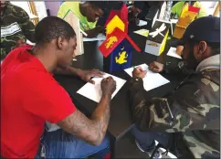  ?? Jacqueline Larma/AP ?? Crafts: Tahire Briscoe, left and Mustaffa Jackson sketch a birdhouse as they participat­e in a session at The Barnes Foundation Wednesday in Philadelph­ia. The Barnes Foundation and Mural Arts Philadelph­ia are collaborat­ing on the "Restorativ­e Justice"...