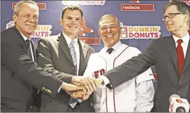  ?? Getty ?? With Boston sitting 131⁄ games out of first entering weekend, the smiles are quickly fading for Red Sox presi
2 dent Larry Lucchino (from l.), GM Ben Cherington, manager Bobby Valentine and owner John Henry.