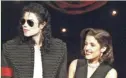  ??  ?? Michael Jackson and Lisa Marie Presley-Jackson share the stage at the MTV Video Music Awards in 1994.