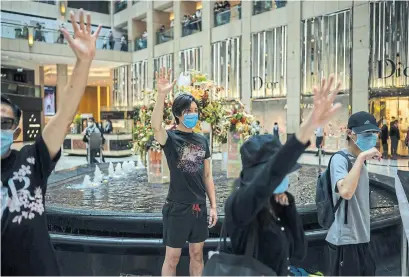  ?? BILLY H.C. KWOK GETTY IMAGES ?? Pro-democracy supporters in Hong Kong gather at a shopping mall during a rally on Monday.