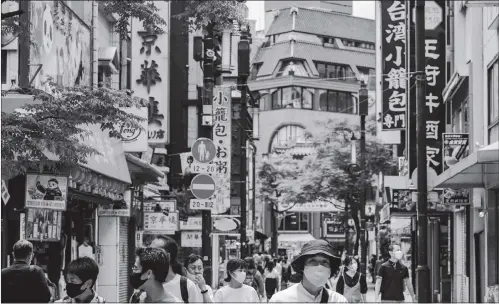  ?? Photo: AFP ?? People wearing face masks visit the Chinatown area in Yokohama on Tuesday. Japan lifted a nationwide state of emergency over the coronaviru­s on Monday.