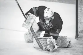  ?? ALAN ARSENAULT/TELEGRAM & GAZETTE ?? Gardner goalie Mark Quinn makes a save during Friday’s game against Lunenburg/Ayer-Shirley.