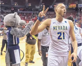  ?? L.E. BASKOW/ASSOCIATED PRESS ?? Nevada’s Kendall Stephens celebrates with fans after the Wolf Pack beat UNLV in a MWC tourney quarterfin­al Thursday afternoon. Stephens scored 15 points in the game.