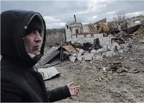  ?? THIBAULT CAMUS THE ASSOCIATED PRESS ?? Mykolai Sirush, 31, shows his house which was destroyed by bombing, in Moshchun, on the outskirts of Kyiv, Ukraine on Sunday.