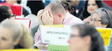  ?? MIKE STOCKER/SUN SENTINEL FILE ?? Volunteers look over ballots Nov. 17 during the hand count at the Broward County Supervisor of Elections office in Lauderhill.