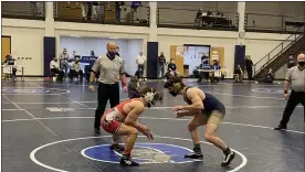  ?? MEDIANEWS GROUP PHOTO ?? La Salle’s Regan Loughney (right) wrestles Easton’s Dominic Falcone in the 172-pound championsh­ip final at the PIAA 3A East Super Regional on Saturday, March 6, 2021at Quakertown High School.