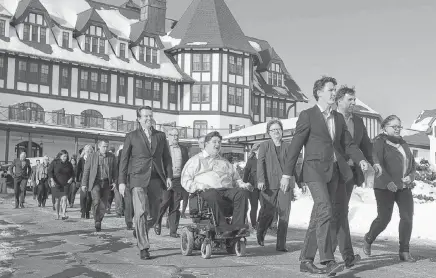  ?? ANDREW VAUGHAN
CP ?? Prime Minister Justin Trudeau leads his cabinet as they stroll to a media availabili­ty during a cabinet retreat at the Algonquin Resort in St. Andrews, N.B., in 2016. •