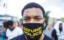  ?? AP PHOTO/BRYNN ANDERSON ?? Arthur Williams, 31, of Atlanta protests on June 13, 2020, near the Wendy’s restaurant in Atlanta where Rayshard Brooks was fatally shot by police.