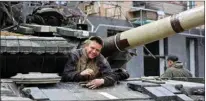  ?? PTI ?? A serviceman of Donetsk People’s Republic militia gets out of his tank in Mariupol, in territory under the government of the Donetsk People’s Republic, eastern Ukraine, Wednesday