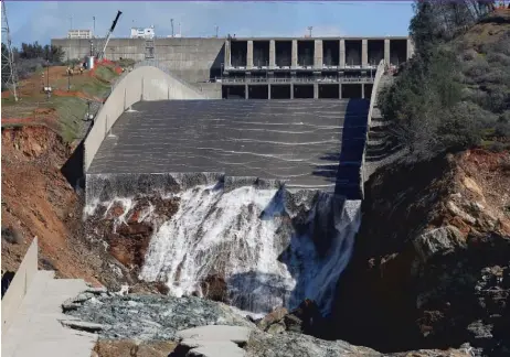  ?? | AP FILE PHOTO ?? Water pours over Oroville Dam’s crippled spillway in California in February.