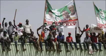  ?? AP PHOTO/SUNDAY ALAMBA ?? Supporters of Nigerian presidenti­al candidate Atiku Abubakar, of the People’s Democratic Party attend an election campaign rally on the street in Yola, Nigeria, on Thursday.