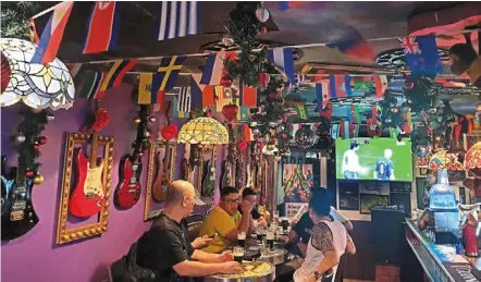  ?? — Chan boon Kai/the star ?? Football fever: Flags of different countries strung up at a sports bar in Chulia street, Penang, in preparatio­n for the FIFA World Cup 2022, which will start on nov 20.
