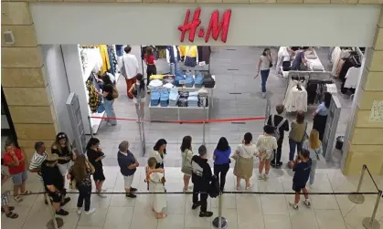  ?? ?? Customers queue outside H&M at the Metropolis shopping mall in Moscow. Photograph: Maxim Shipenkov/EPA