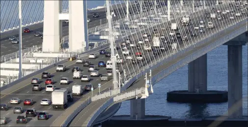  ?? STAFF ARCHIVES ?? Commute traffic on the Bay Bridge, November 2021. The Bay Area and California recoveries from the mammoth job losses unleashed by coronaviru­s-linked business shutdowns are far stronger than first thought.