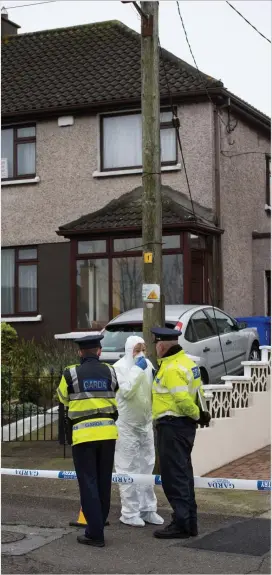 ??  ?? Scene: Gardaí and forensics experts outside the house in Cork city