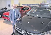  ?? KENN OLIVER/THE TELEGRAM ?? This time next year, Dan Matthews, dealer principal at Bill Matthews Volkswagen Audi, will be getting ready to move all the company’s Volkswagen vehicles and staff to a new 44,000-square-foot facility on Kelsey Drive. After the move, the current...
