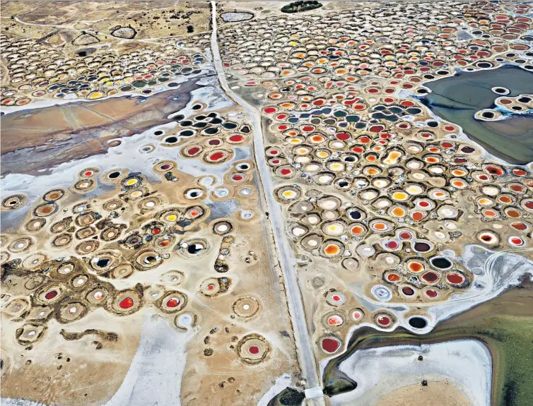  ?? ?? Painterly: Salt Ponds #4, Near Naglou Sam Sam, Senegal (2019) by Burtynsky, below