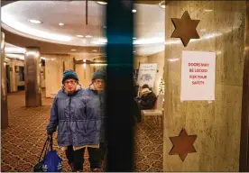  ?? CHANG W. LEE PHOTOS / THE NEW YORK TIMES ?? Magnetical­ly locking doors were recently installed at East Midwood Jewish Center in Brooklyn. Enhancing security for Jewish institutio­ns, and how to pay for it, has become an urgent issue for religious leaders and local and state government­s.