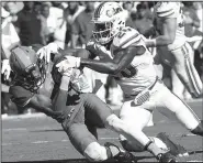  ?? Chattanoog­a Times Free Press/ROBIN RUDD ?? Tennessee wide receiver Josh Malone (left) holds on to the ball while being hit by Florida safety Marcus Maye in the second half. The Volunteers ended their 11-game losing skid to the Gators with a 38-28 come-from-behind victory. It was Tennessee’s...