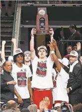  ?? TIM HEITMAN/USA TODAY SPORTS ?? North Carolina State forward Ben Middlebroo­ks and teammates celebrate with the South Regional trophy after defeating Duke to reach the Final Four of the 2024 NCAA men’s tournament.