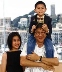  ?? GERARD JULIEN/AFP VIA GETTY IMAGES/FILE 2000 ?? Edward Yang and actors Kelly Lee and Jonathan Chang.