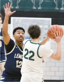  ?? JOHN SMIERCIAK/DAILY SOUTHTOWN ?? Lemont’s Miles Beachum ties to block a pass by Evergreen Park’s Nolan Sexton during Friday’s South Suburban Conference crossover in Evergreen Park.