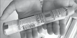  ?? Lucas Trieb AFP/Getty Images ?? THERE’S ABOUT a dollar’s worth of epinephrin­e in each EpiPen, to which Mylan acquired the rights in 2007 and proceeded to impose double-digit price hikes.